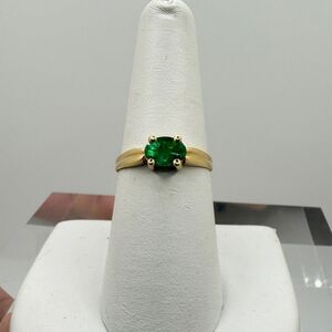 Genuine 5x7 oval cut, faceted Emerald solitaire east/west ring in 14kt YG!